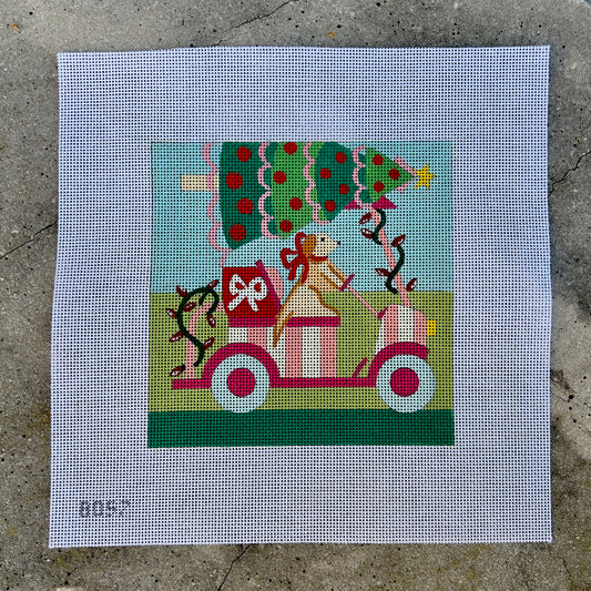 Dog on Pink Golf Cart with Christmas Tree